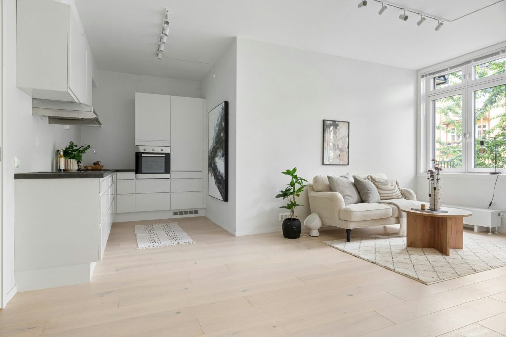 A living room filled with furniture and a large window